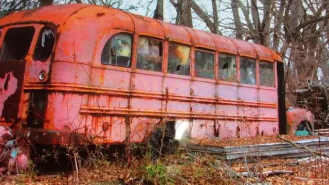 Burnt out pink bus