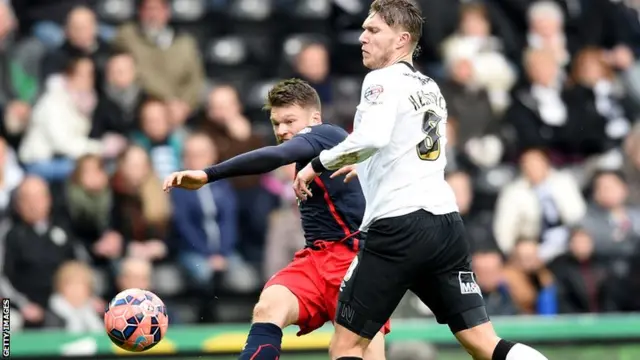 Jamie Macky of Derby takes on the Reading defence