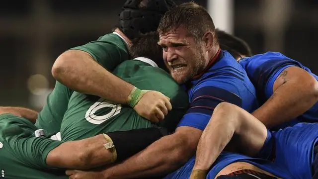 Vincent Debaty winces as Ireland drive forward