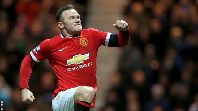 Wayne Rooney celebrates converting his penalty