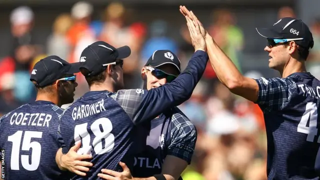 Scotland celebrate Luke Ronchi's wicket