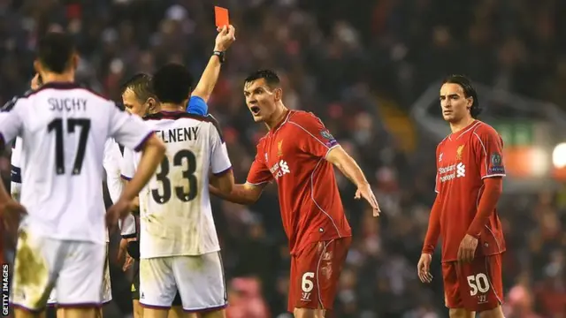 Liverpool's Lazar Markovic (right) is sent off against basel