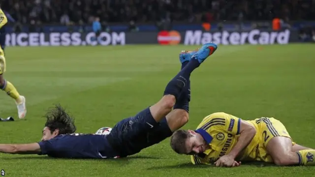 Edinson Cavani is fouled by Branislav Ivanovic