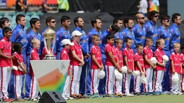 Afghanistan players stand for their national anthem