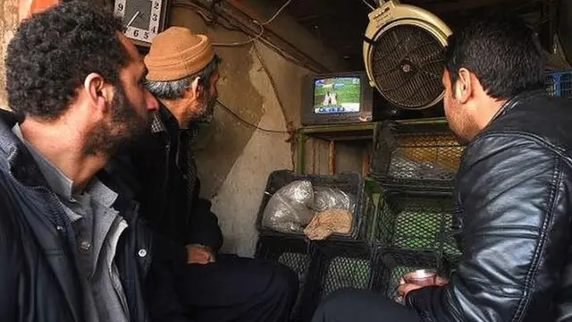 People watch the cricket in Afghanistan