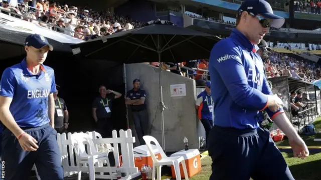 England's players come out to bat