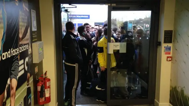 group of young people waiting to get into the People's Cup