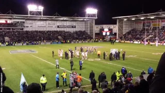 Warrington and St George players shake hands at the end of the match