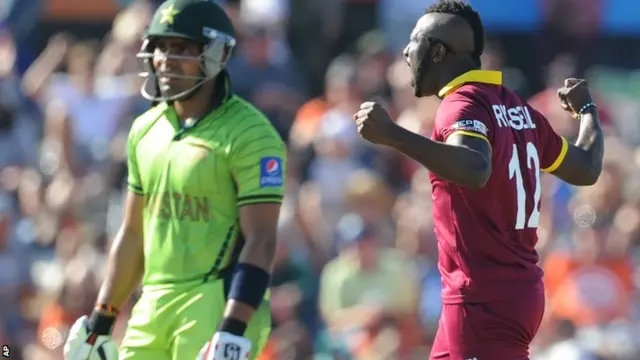 Andre Russell celebrates the dismissal of Umar Akmal