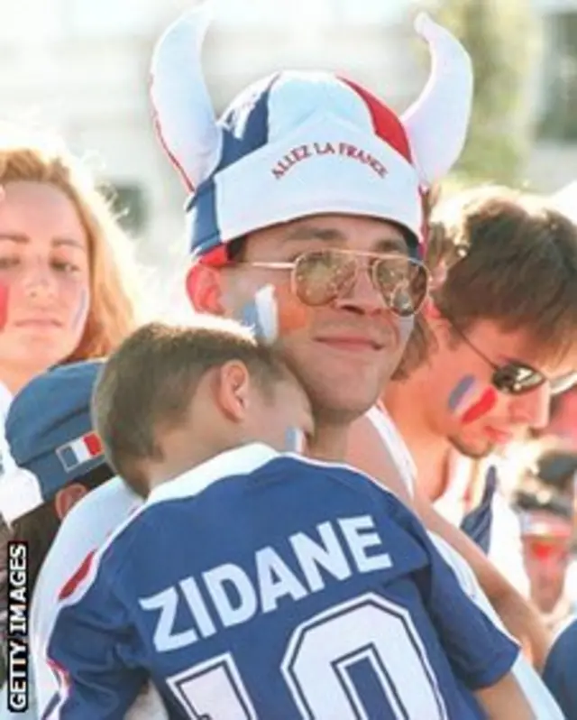 Child asleep wearing Zidane shirt