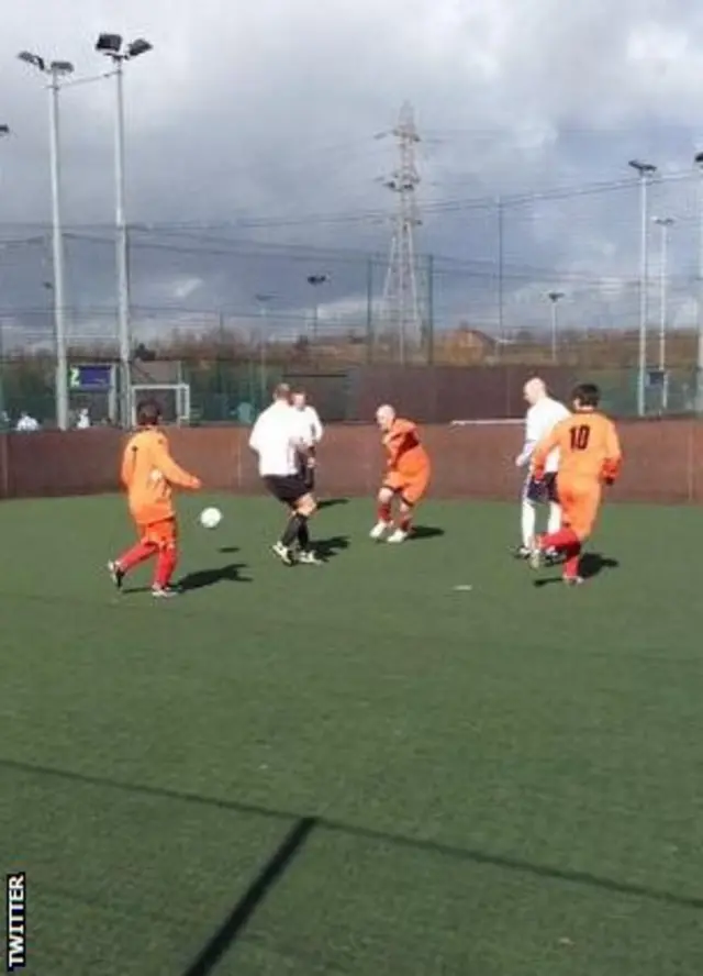 action shot of a veteran team playing football in the People's Cup