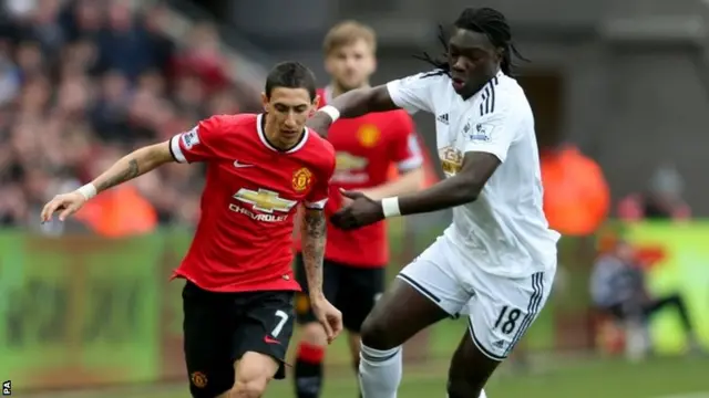 Angel Di Maria of Manchester United and Swansea City's Bafetimbi Gomis