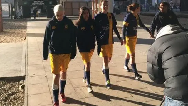 Female 5-a-side team walking like reservoirs dogs