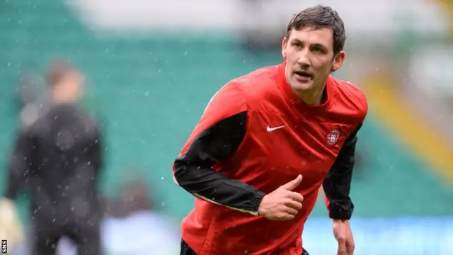 Hamilton player-manager Martin Canning warms up