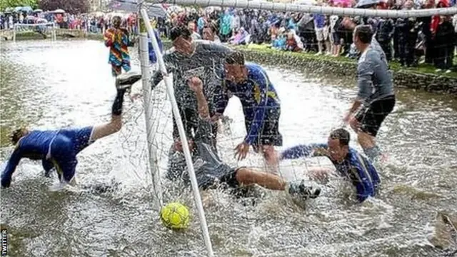 People's Cup people playing in very wet pitch