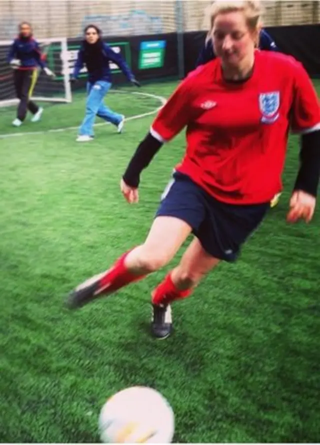 Girl playing football