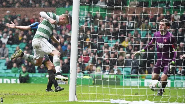 John Guidetti heads Celtic into a 3-0 lead