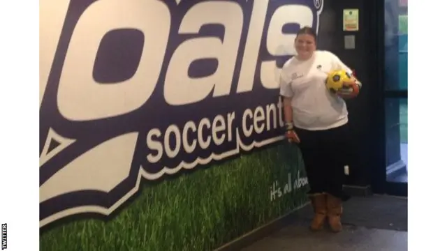 People's Cup girl holding football ready to play