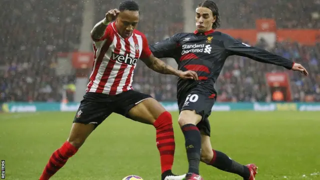 Nathaniel Clyne is tackled by Lazar Markovic