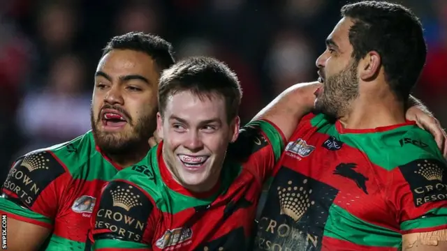 Luke Keary (centre) celebrates