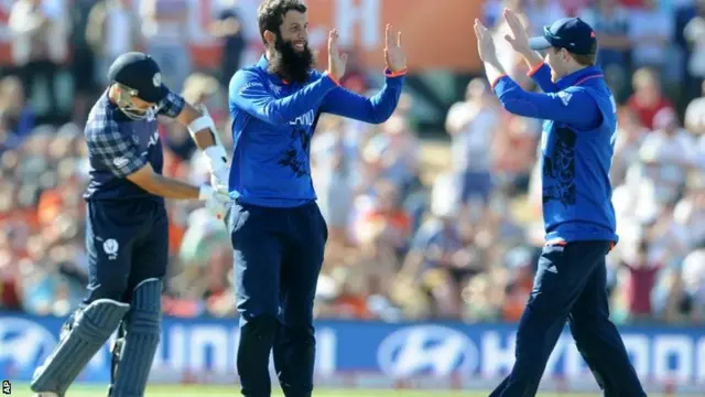 Moeen Ali celebrates having bowled out Scotland's Richie Berrington