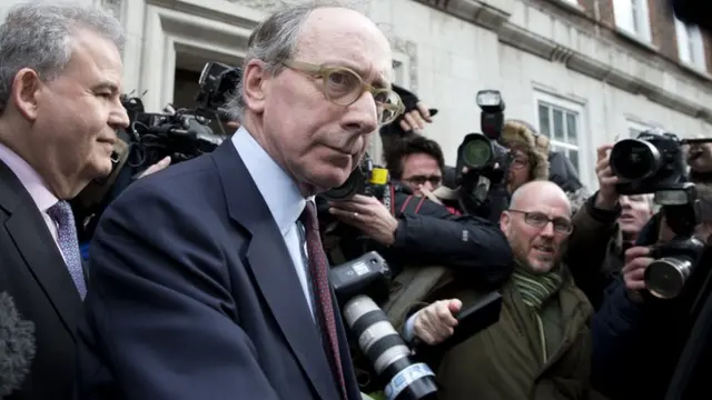 Sir Malcolm Rifkind surrounded reporters