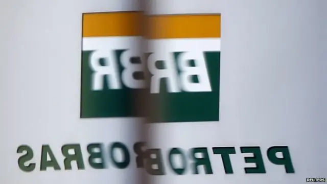 The Petrobras logo is reflected in the window of the company"s headquarters in Sao Paul