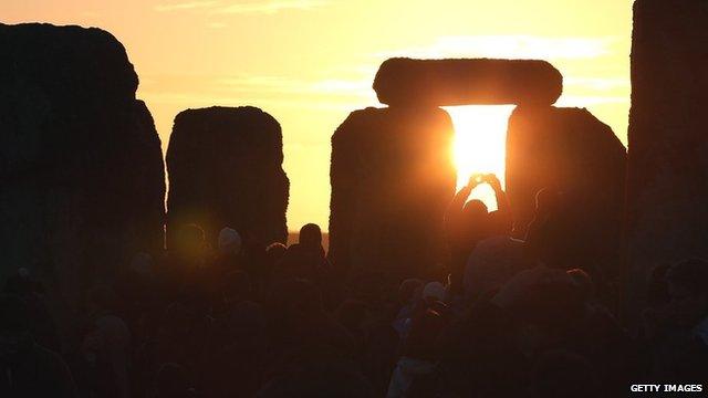 Sun rising at Stonehenge