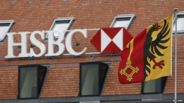 An HSBC logo pictured behind the flag of the canton of Geneva at a Swiss branch of the bank in Geneva