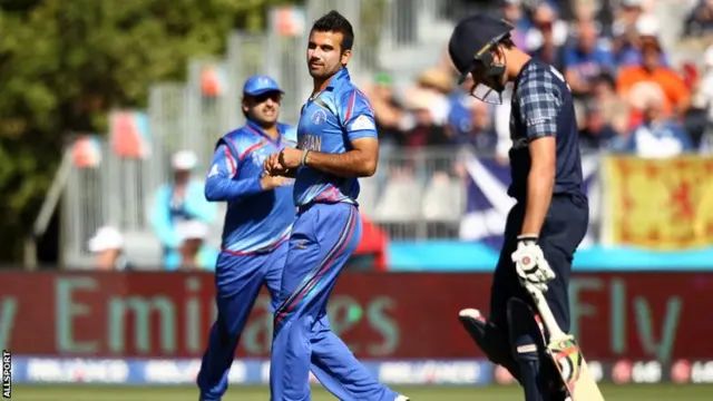 Dawlat Zadran (C) of Afghanistan celebrates after dismissing Calum Macleod