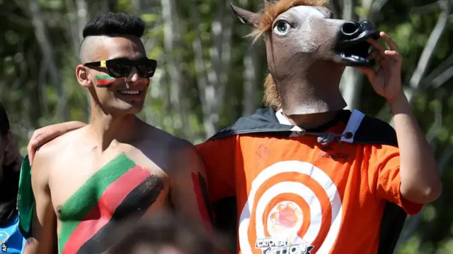 Afghanistan fan and a man dressed as a horse