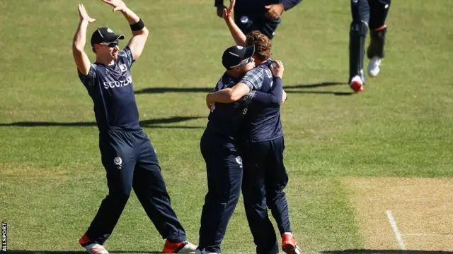 Scotland celebrate taking a wicket