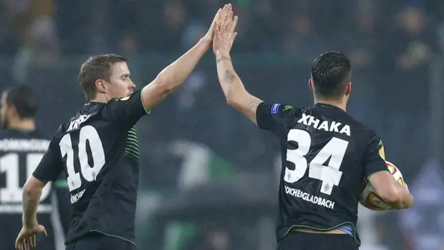 Borussia Monchengladbach goalscorer Granit Xhaka celebrates with his team-mate Max Kruse