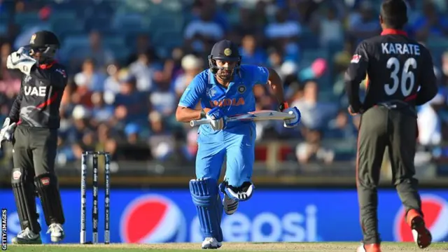 Rohit Sharma takes a run