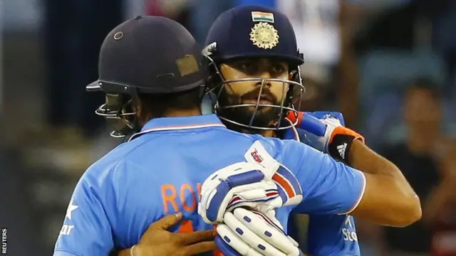 Rohit Sharma and Virat Kohli embrace after defeating the UAE