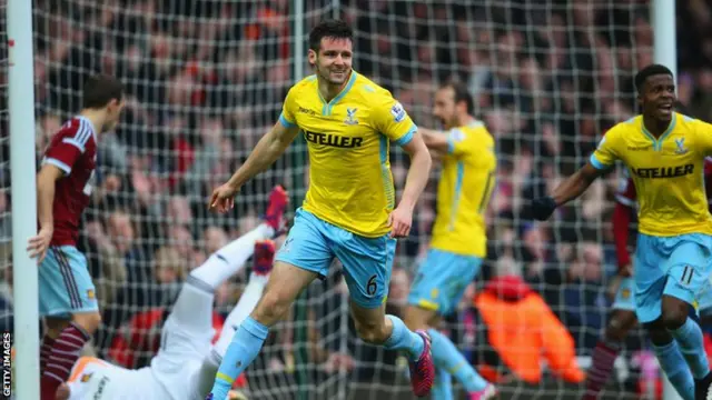 Scott Dann celebrates