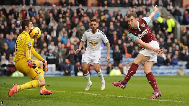 Fabianski saves Barnes' shot