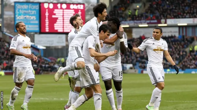 Swansea celebrate Trippiers own goal