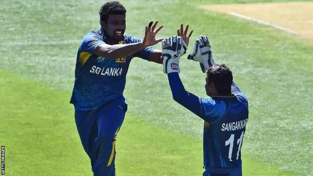 Perera celebrates