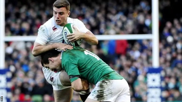 Ireland's Jonathan Sexton (R) tackles England's George Ford