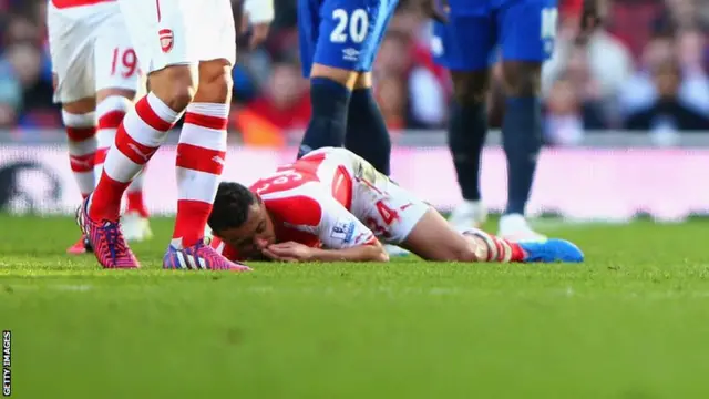 Francois Coquelin lies injured