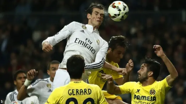 Gareth Bale heads towards goal