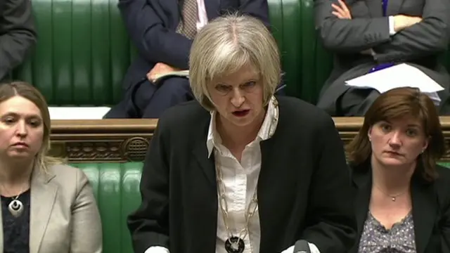 Home Secretary Theresa May defending the government's counter-terrorism policies in the House of Commons