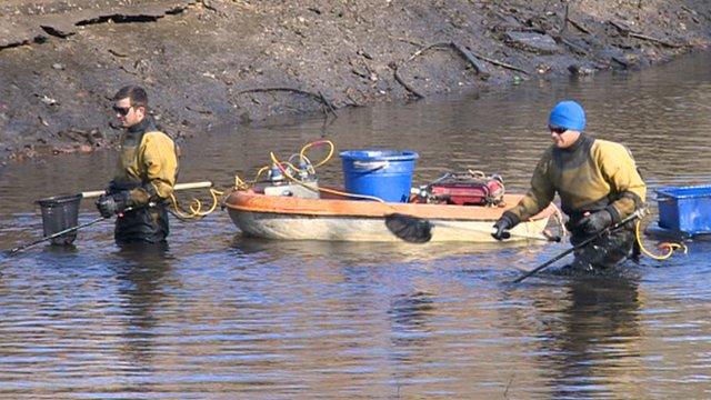 Two men fishing in Tinsley canal