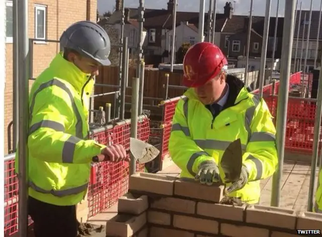 David Cameron buidling a wall