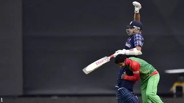 Scotland batsman Kyle Coetzer (top) is run into by Bangladesh bowler Sabbir Rahman