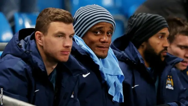 Vincent Kompany on the Manchester City bench