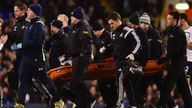 Bafetimbi Gomis is stretchered off