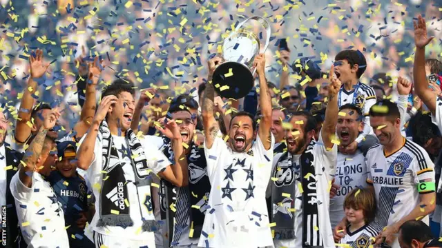 LA Galaxy players celebrate winning the MLS Cup last season