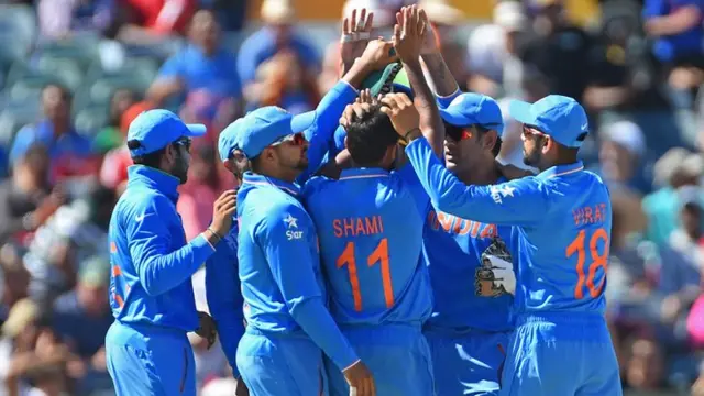 India celebrate Dwayne Smith's wicket